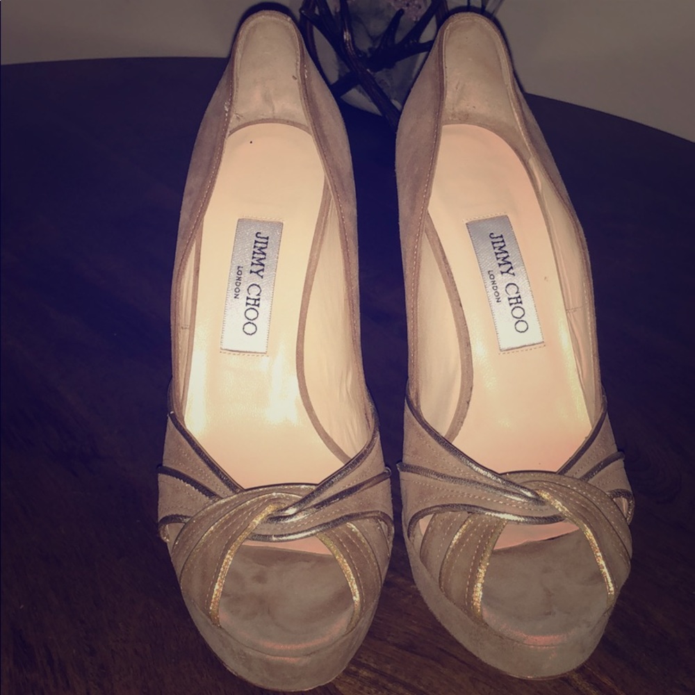 Jimmy Choo- Platforms: 1.25"
Heels: 5.25"